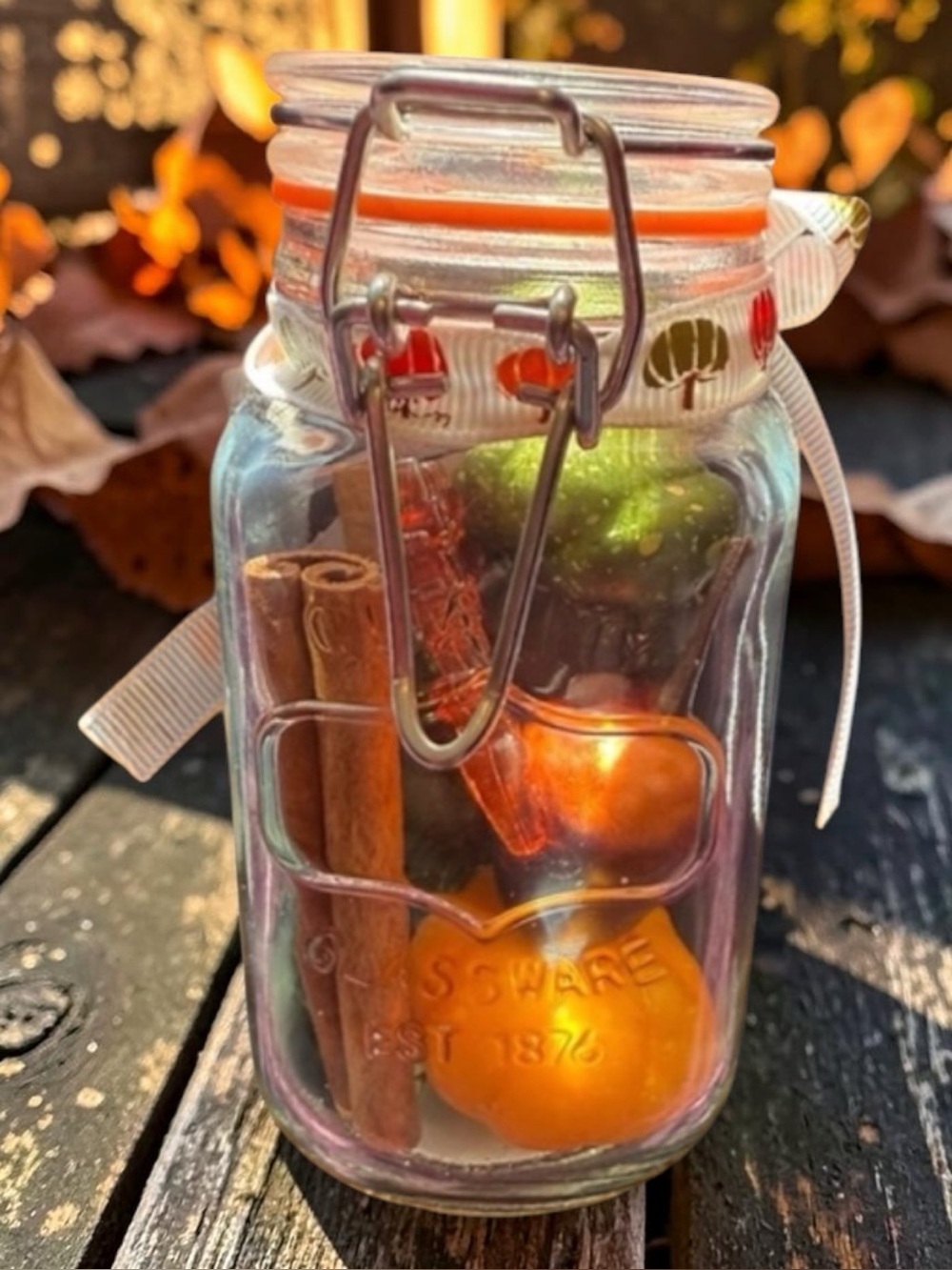 Festive Glass Jar with pumpkin, cinnamon sticks and acorn Accents